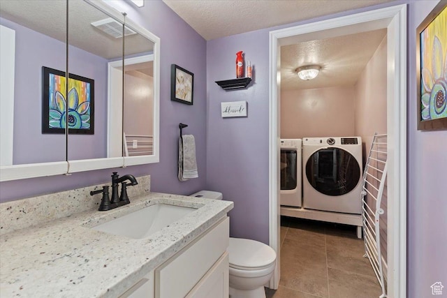 298 W 1775 N, Harrisville, UT 84414 - bathroom with separate washer and dryer, toilet, vanity, a textured ceiling, and tile patterned floors