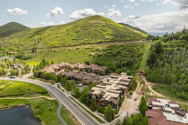 2900 Deer Valley Dr E Unit E211, Deer Valley, UT 84060 - aerial view of property and surrounding area with a water and mountain view, nearby suburban area, and a heavily wooded area