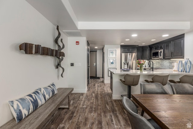2900 Deer Valley Dr E Unit E211, Deer Valley, UT 84060 - kitchen with stainless steel appliances, light countertops, a kitchen bar, a peninsula, and recessed lighting