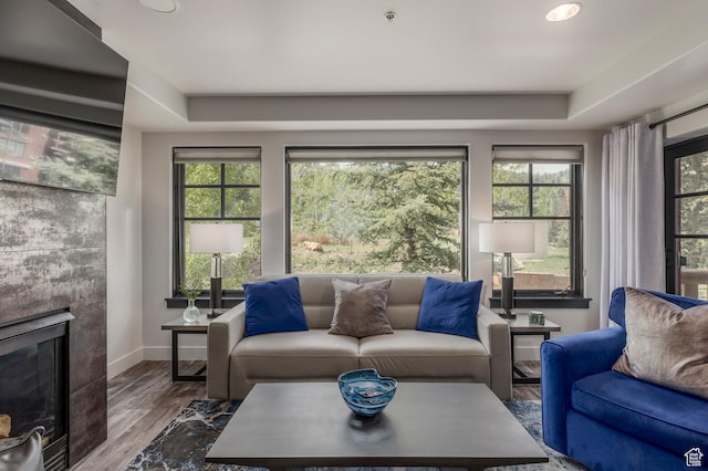2900 Deer Valley Dr E Unit E211, Deer Valley, UT 84060 - living room with plenty of natural light, a glass covered fireplace, wood finished floors, a raised ceiling, and recessed lighting