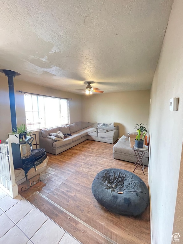 3301 S 1500 E, Vernal, UT 84078 - living room with a textured ceiling, a ceiling fan, and wood finished floors