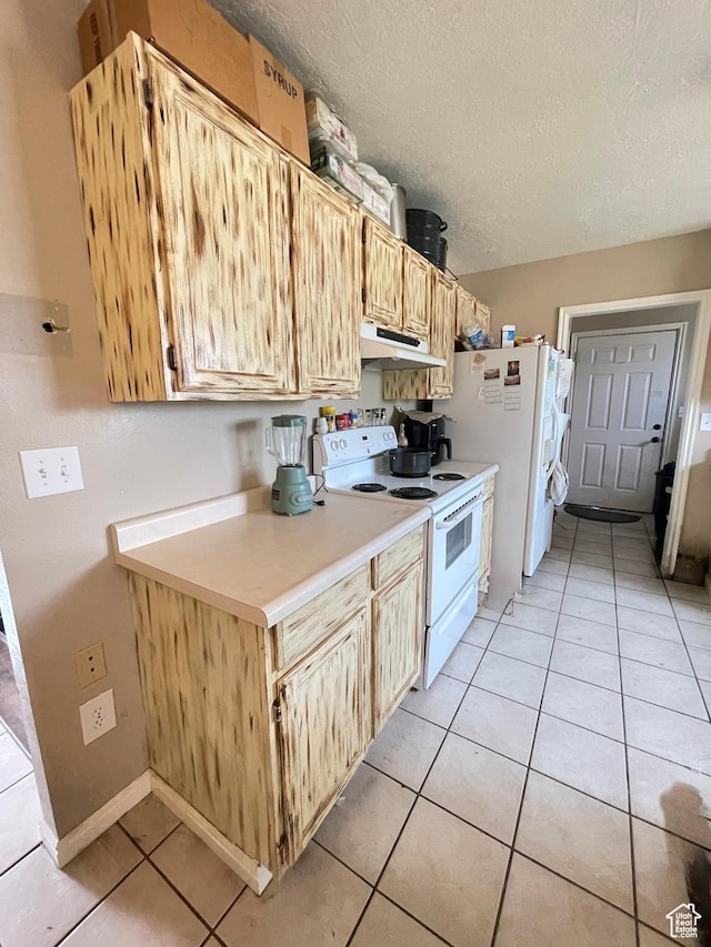3301 S 1500 E, Vernal, UT 84078 - kitchen featuring white appliances, under cabinet range hood, a textured ceiling, light countertops, and light tile patterned floors