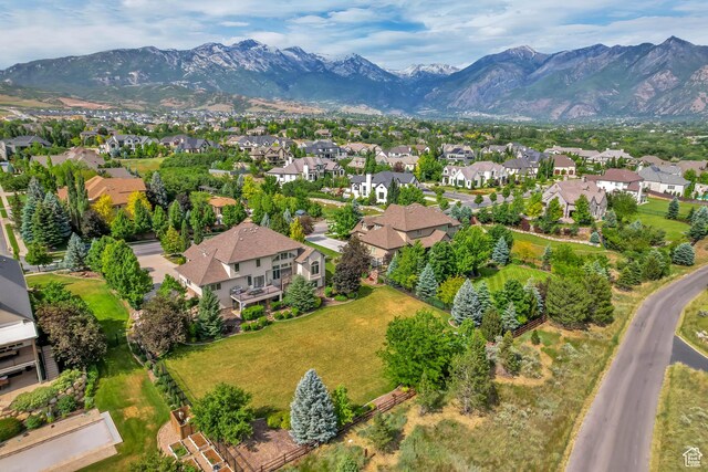 6663 W Normandy Way, Highland, UT 84003 - aerial view of property and surrounding area featuring nearby suburban area and mountains