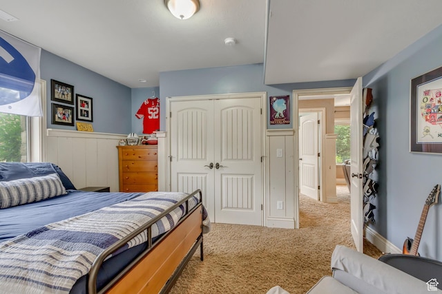 6663 W Normandy Way, Highland, UT 84003 - carpeted bedroom featuring a closet and a wainscoted wall