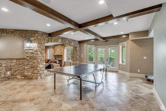 6663 W Normandy Way, Highland, UT 84003 - recreation room featuring beamed ceiling, baseboards, french doors, a fireplace, and recessed lighting