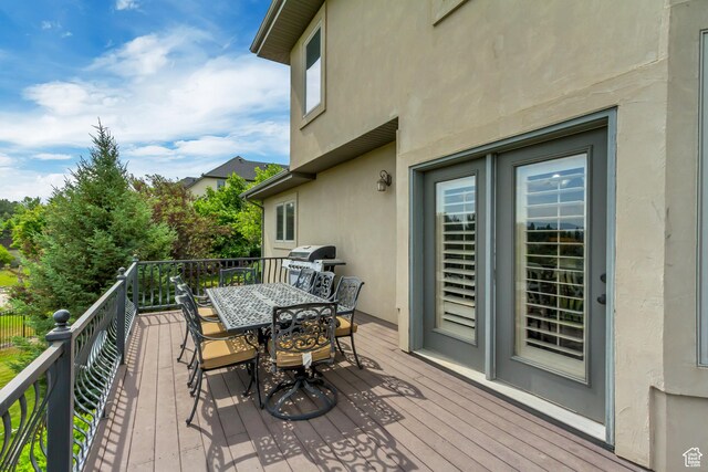 6663 W Normandy Way, Highland, UT 84003 - deck featuring outdoor dining area and area for grilling