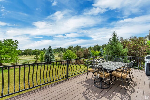 6663 W Normandy Way, Highland, UT 84003 - deck featuring outdoor dining area and a yard