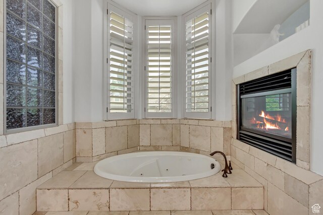 6663 W Normandy Way, Highland, UT 84003 - bathroom featuring a tub with jets and plenty of natural light