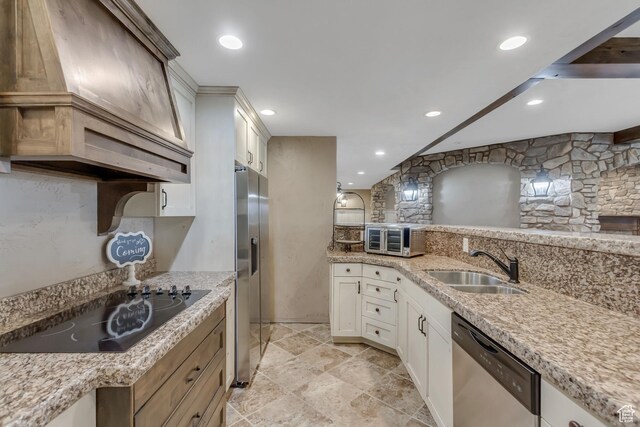 6663 W Normandy Way, Highland, UT 84003 - kitchen featuring stainless steel appliances, a sink, custom range hood, recessed lighting, and light stone counters