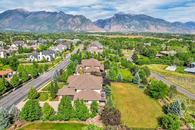 6663 W Normandy Way, Highland, UT 84003 - aerial perspective of suburban area featuring a mountainous background