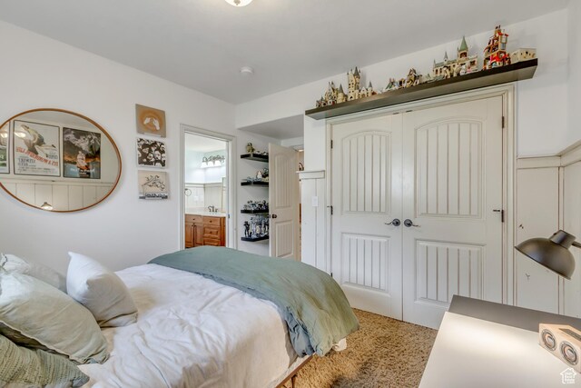 6663 W Normandy Way, Highland, UT 84003 - bedroom featuring a closet, light carpet, and ensuite bath