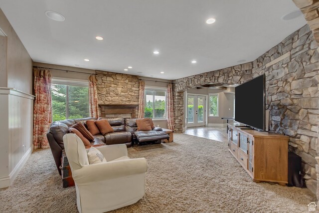 6663 W Normandy Way, Highland, UT 84003 - living room with a fireplace, recessed lighting, healthy amount of natural light, and light colored carpet