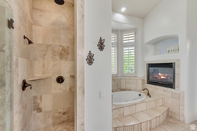 6663 W Normandy Way, Highland, UT 84003 - full bathroom featuring a jetted tub, a tiled fireplace, a tile shower, and tile patterned floors