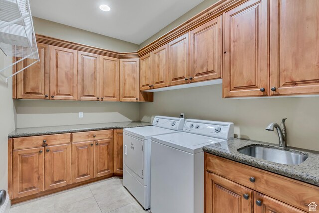 6663 W Normandy Way, Highland, UT 84003 - laundry room featuring cabinet space, washing machine and dryer, and light tile patterned floors