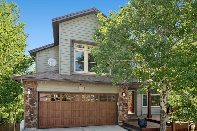 8086 N Meadowview Dr, Snyderville, UT 84098 - view of front facade featuring a garage, concrete driveway, and a shingled roof