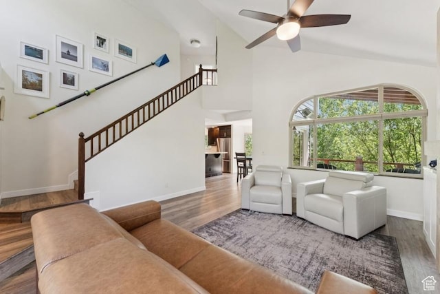 8086 N Meadowview Dr, Snyderville, UT 84098 - living room featuring a ceiling fan, wood finished floors, baseboards, and high vaulted ceiling