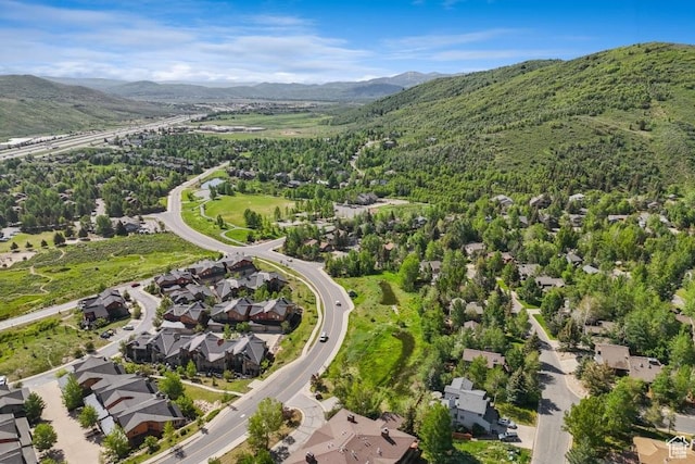 8086 N Meadowview Dr, Snyderville, UT 84098 - aerial overview of property's location with mountains and nearby suburban area