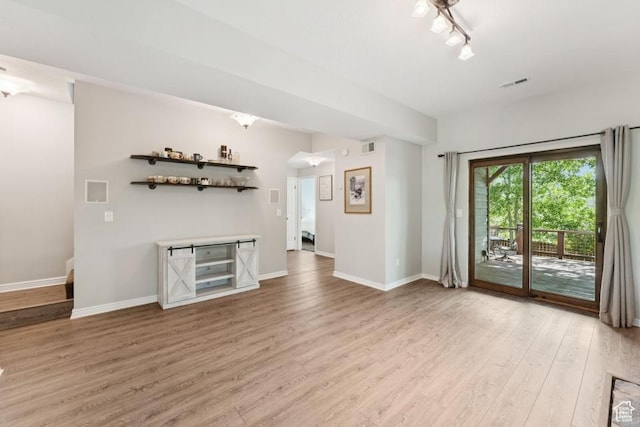 8086 N Meadowview Dr, Snyderville, UT 84098 - unfurnished living room with light wood-style floors and baseboards