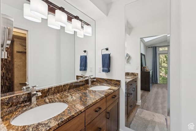 8086 N Meadowview Dr, Snyderville, UT 84098 - bathroom featuring double vanity, wood finished floors, and vaulted ceiling
