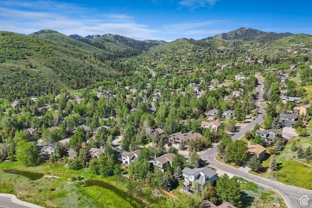 8086 N Meadowview Dr, Snyderville, UT 84098 - aerial view of property and surrounding area with a mountain backdrop and nearby suburban area