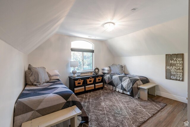1110 S Woodland Hills Dr, Woodland Hills, UT 84653 - bedroom with wood finished floors, vaulted ceiling, and baseboards