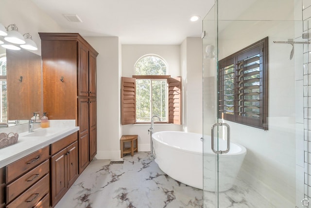 1110 S Woodland Hills Dr, Woodland Hills, UT 84653 - full bath with vanity, a soaking tub, marble tiled flooring, baseboards, and an enclosed shower