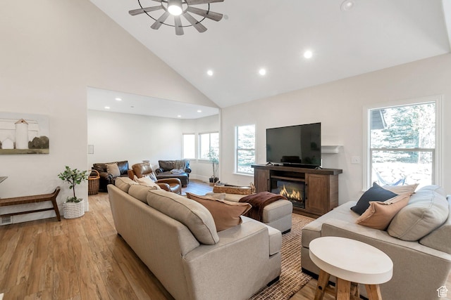 1110 S Woodland Hills Dr, Woodland Hills, UT 84653 - living area with high vaulted ceiling, light wood-style floors, recessed lighting, ceiling fan, and a glass covered fireplace