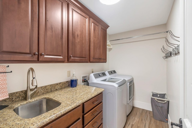 1110 S Woodland Hills Dr, Woodland Hills, UT 84653 - washroom featuring cabinet space, washer and dryer, light wood-style floors, and baseboards