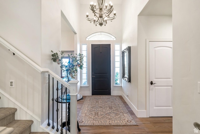 1110 S Woodland Hills Dr, Woodland Hills, UT 84653 - entrance foyer featuring wood finished floors, a high ceiling, a chandelier, stairway, and baseboards