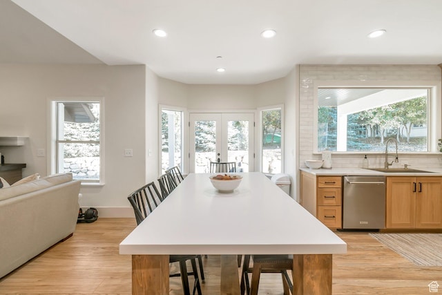 1110 S Woodland Hills Dr, Woodland Hills, UT 84653 - kitchen with stainless steel dishwasher, light wood finished floors, a sink, recessed lighting, and plenty of natural light