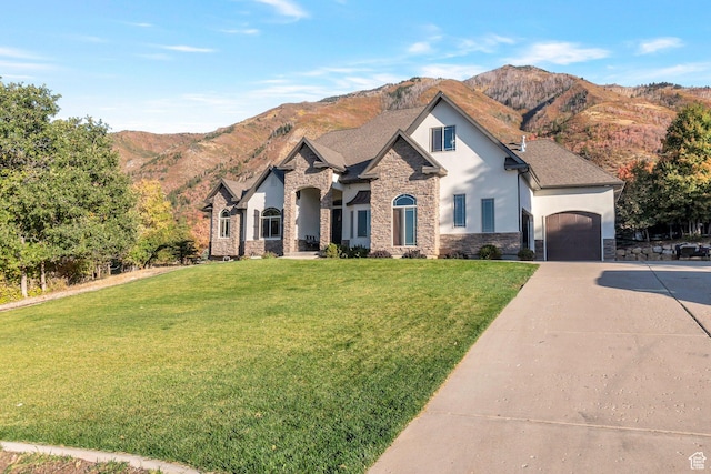1110 S Woodland Hills Dr, Woodland Hills, UT 84653 - french country inspired facade with stone siding, stucco siding, a garage, driveway, and a front yard