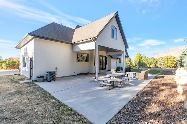 1110 S Woodland Hills Dr, Woodland Hills, UT 84653 - rear view of property featuring stucco siding, a shingled roof, and a patio