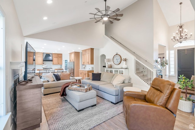 1110 S Woodland Hills Dr, Woodland Hills, UT 84653 - living room featuring high vaulted ceiling, ceiling fan, stairs, light wood finished floors, and a fireplace