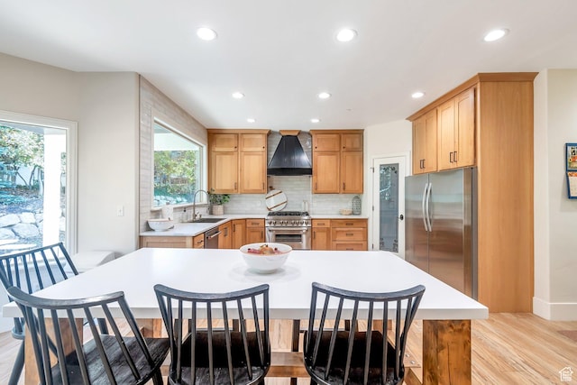 1110 S Woodland Hills Dr, Woodland Hills, UT 84653 - kitchen with appliances with stainless steel finishes, custom range hood, a sink, recessed lighting, and light countertops