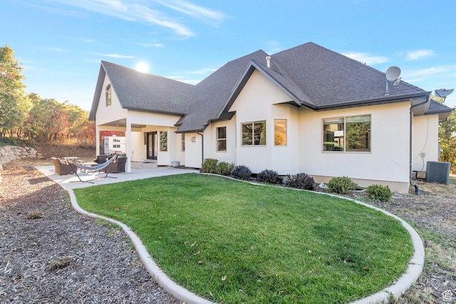 1110 S Woodland Hills Dr, Woodland Hills, UT 84653 - back of property featuring roof with shingles, cooling unit, stucco siding, a yard, and a patio area