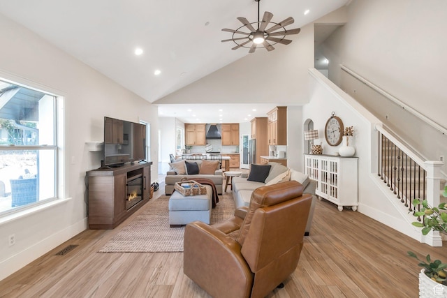1110 S Woodland Hills Dr, Woodland Hills, UT 84653 - living area with light wood-style flooring, ceiling fan, high vaulted ceiling, baseboards, and recessed lighting