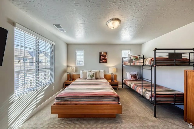 1914 E Fiesta Ln, Washington, UT 84780 - bedroom featuring carpet floors, a textured ceiling, and baseboards