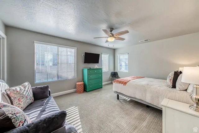 1914 E Fiesta Ln, Washington, UT 84780 - bedroom with light carpet, baseboards, and a ceiling fan