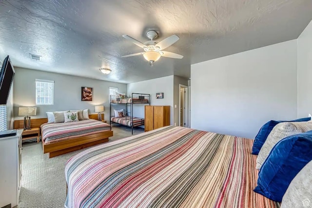 1914 E Fiesta Ln, Washington, UT 84780 - carpeted bedroom featuring a textured ceiling and ceiling fan