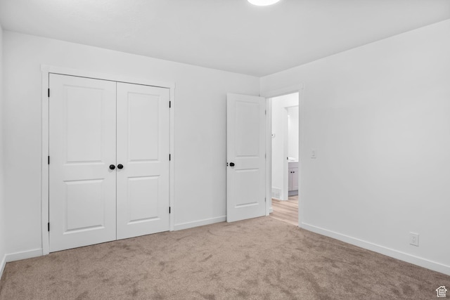 3717 W 8620 S, West Jordan, UT 84088 - unfurnished bedroom with light colored carpet, baseboards, and a closet