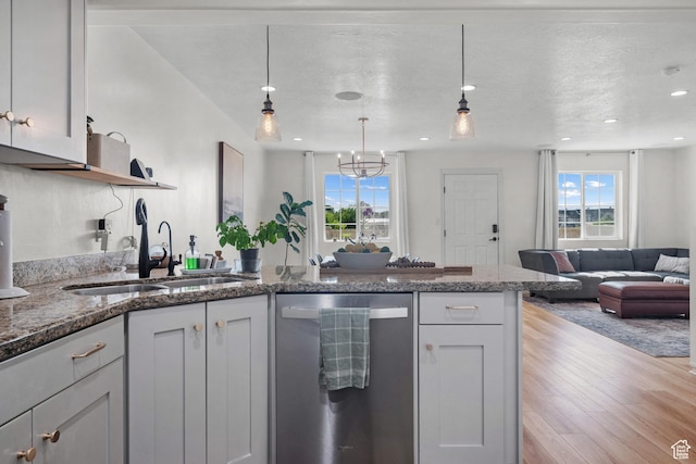 1146 S 2880 E, Spanish Fork, UT 84660 - kitchen featuring dishwasher, open floor plan, healthy amount of natural light, wood finished floors, and a textured ceiling