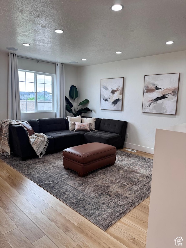 1146 S 2880 E, Spanish Fork, UT 84660 - living room featuring recessed lighting, wood finished floors, and a textured ceiling