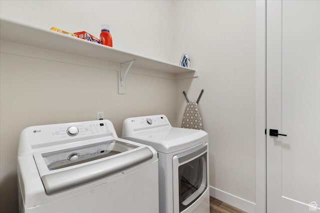 5936 N Angels Landing Dr, Mountain Green, UT 84050 - washroom featuring washing machine and dryer, wood finished floors, and baseboards