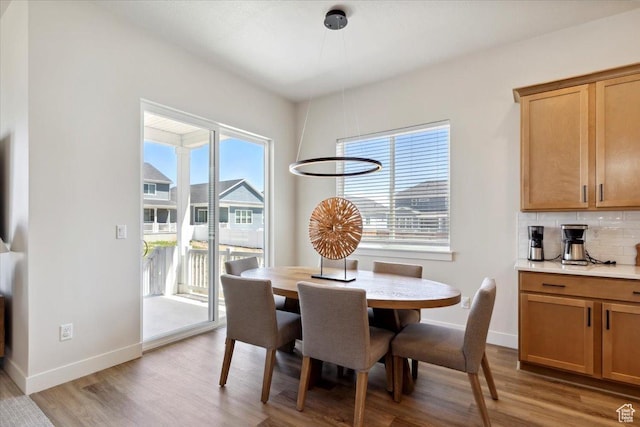 5936 N Angels Landing Dr, Mountain Green, UT 84050 - dining area with light wood finished floors and baseboards