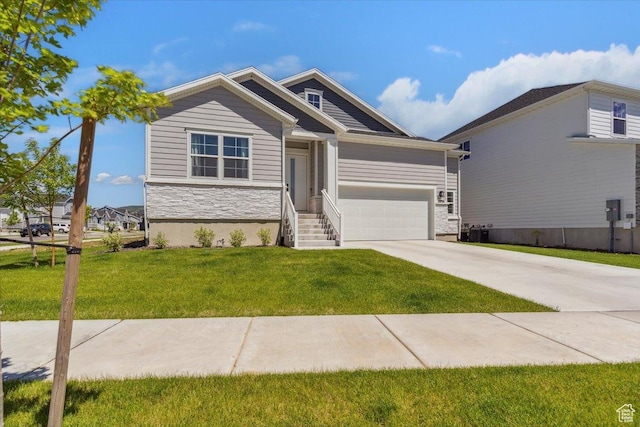 5936 N Angels Landing Dr, Mountain Green, UT 84050 - view of front of property featuring stone siding, driveway, a front yard, and an attached garage