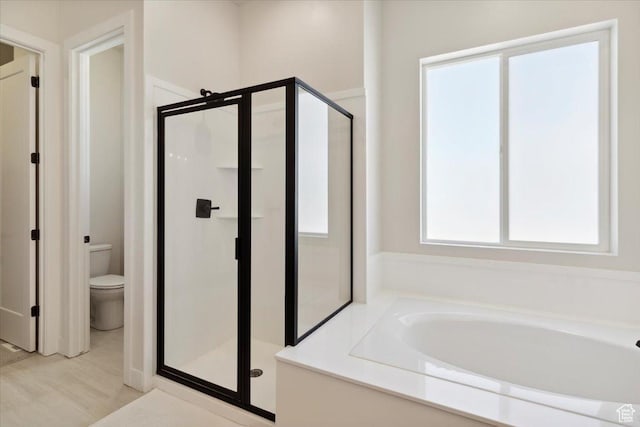 5936 N Angels Landing Dr, Mountain Green, UT 84050 - full bath with a stall shower, a garden tub, and toilet