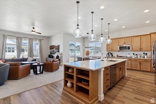 5936 N Angels Landing Dr, Mountain Green, UT 84050 - kitchen with appliances with stainless steel finishes, a sink, open floor plan, light countertops, and open shelves