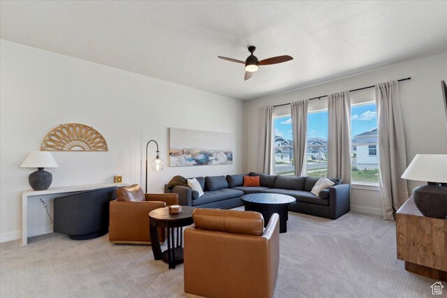 5936 N Angels Landing Dr, Mountain Green, UT 84050 - living area with light carpet, a ceiling fan, and baseboards