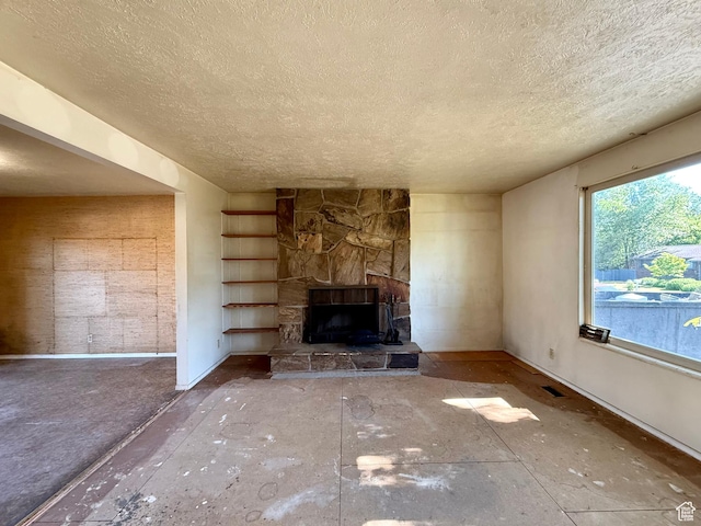 8731 S Gladiator Way, Sandy, UT 84094 - unfurnished living room featuring a textured ceiling and baseboards