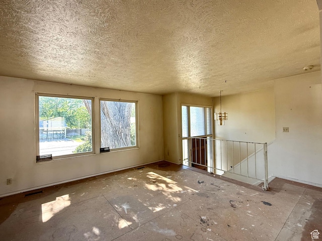 8731 S Gladiator Way, Sandy, UT 84094 - spare room featuring a textured ceiling and baseboards